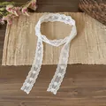 Detail shot of white floral lace ribbon scarf with delicate embroidery patterns - Fine Floral (Style 3) / White