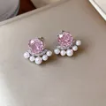 Detailed view of elegant pink zircon stud earrings with small white pearls and crystals - Silver Needle Silver Style / Pink