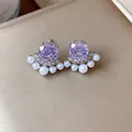 Detailed view of French style purple zircon flower earrings with delicate white pearls. - Silver Needle Silver Style / Purple