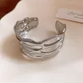 Close-up of silver-toned metal cuff bracelet with wavy textured striped design - 纹路条纹开口款式(HB5768) / Silver