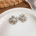 Close-up of elegant silver firework stud earrings with sparkling zircon and pearl accents - Fireworks Style (HE32747) / Silver-White