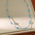 Elegante collar de malla plateada con circonitas azules ovaladas brillantes SKU - Collar / Azul