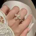 Exquisite gold-plated open ring featuring a sparkling zircon star-flower cluster design. - Gold