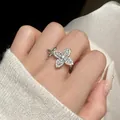 Exquisite sparkling zircon star flower open ring in silver finish worn on index finger - Silver