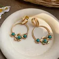Detailed view of French retro flower earrings with turquoise beads in gold finish - 925 Silver Needle / Gold-Blue