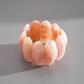 Detail of peach marbled acrylic bracelet with smooth petal-shaped links. - Petal-shaped Beaded Bracelet