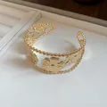 Macro detail view of vintage gold metallic floral textured open cuff bracelet for women - Beaded Floral Style (7#)