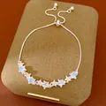 Close-up view of adjustable bolo bracelet featuring sparkling zircon and blue star charms - Adjustable Star Style / Silver With Blue