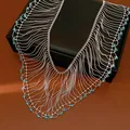 Close-up detail of luxury court style fringe necklace with sparkling light blue glass beads - Necklace - Silver - Blue