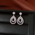 Macro detail of teardrop zirconia dangle earrings with elegant 18K gold plating finish - Teardrop Pendant / Silver