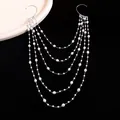 Detailed view of the layered pearl chain structure on the elegant silver ear wrap. - Unique Tassel Ear Wrap / Silver