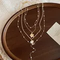 Χρυσό πολύστρωτο κολιέ με πέρλες, κοχύλι και λουλούδια, ιδανικό για μποέμ καλοκαιρινό στυλ. - Πολυεπίπεδο Στυλ / Χρυσό