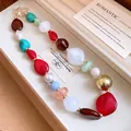 Macro detail of a colorful irregular resin bead necklace with Bohemian aesthetic - Basic Necklace