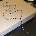 Elegant black and white beaded necklace with pearls displayed on a luxury jewelry stand - Single Layer / Silver Black