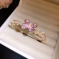 Close-up of elegant double-layer open bangle featuring a pink zircon butterfly design - Gold-Pink