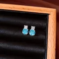 Elegant vintage silver needle stud earrings with blue and clear round zircons in jewelry box - Blue