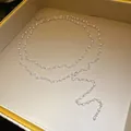 Elegant double-layered pearl and crystal Y-shaped necklace displayed in a luxury jewelry gift box. - White Multi Tier / Silver