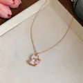 Macro view of a cute rose gold cat pendant featuring white mother-of-pearl shell inlay detail - Cat Pendant Style / Necklace-Rose Gold