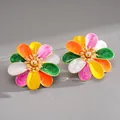 Detailed macro view of colorful enamel flower stud earrings in vibrant dopamine styles - Steel Needle Style / Colorful