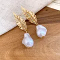 Elegant vintage golden feather stud earrings with irregular Baroque pearls for women - Gold-White (HE33545)