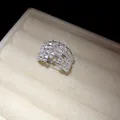 Macro view of sparkly multi-layered zircon hollow open ring in a white jewelry box - Multi-Layer Zirconia Inlaid Style (HR3134) / Silver