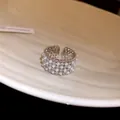 Detailed macro view of a luxury adjustable open ring with pearls and sparkling zircons - Multi-row Pearl Wide Ring (HR3606) / Silver-White