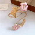 Exquisite detail of gold metal arm cuff featuring pink enamel flowers and elegant pearls - Dripping Oil Flower Style (HB5788) / Pink