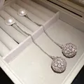Elegant silver drop earrings featuring pearls and crystal-encrusted spheres in a jewelry box. - French Drop Style (HE33159) / Silver