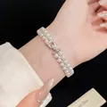 Elegant French vintage double-layer pearl and zircon beaded bracelet shown on a woman's wrist. - French Vintage Double Layer Beaded (HB6038) / Silver White