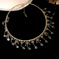 Macro view of elegant gold lace fringe choker featuring delicate crystal bead drops - Gold-White