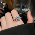 Macro shot of a sparkling purple zircon flower ring with exquisite petal design details - Silver-Purple