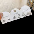 Nahaufnahme von eleganten Schmetterling und Herz Zirkon Ohrsteckern auf Displaykarte - 6-Teiliges Set / Silber