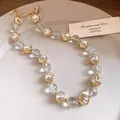 Detailed view of sparkling rhinestones and gold square charms on the elegant beaded necklace. - Necklace / Gold