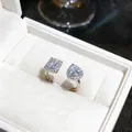 Macro detail of silver open ring featuring pear and emerald cut zircon stones - Double Stone Open Style (2#) / Silver