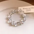 Macro view of elegant crystal beaded choker necklace with silver rhinestone accents - Bracelet / Silver
