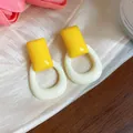 Geometric resin drop earrings in vibrant yellow and cream for a modern minimalist look - Yellow-White