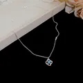 Elegant silver chain necklace featuring a delicate flower pendant with blue zircon - Blue