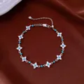 Detail of silver-tone floral bracelet with sparkling rhinestones and turquoise accents. - No 8 Petal Splicing Style