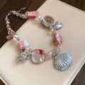 Detailansicht der Halskette mit Muschel- und Seesternanhängern im Urlaubsstil - Rosa