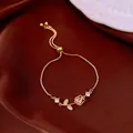 Elegant gold box chain bracelet with pink tulip crystal charm and adjustable clasp - No 12 Tulip Pull Style