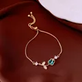 Elegant Korean style gold adjustable bracelet featuring a blue teardrop gemstone charm - No 13 Blue Floral Style