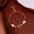 Elegant gold-plated heart charm bracelet with white inlay and sparkling pavé crystals. - No 14 Heart Splicing Style