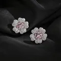 Elegant pink and white cubic zirconia flower stud earrings on black fabric background - Stud Earrings / Silver Earring Post - Silver - Pink