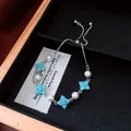 Silver bracelet with turquoise clover charms and white pearls in a jewelry tray - No 27 Silver Clover Pearl Style