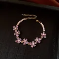 Elegant gold-tone charm bracelet featuring purple water-drop crystal flowers for women - No 30 Purple Waterdrop Floral Style