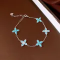 Elegant silver bracelet featuring five turquoise flower charms with pavé set blue stones - No 32 Light Blue Floral Cluster Style