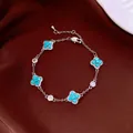 Elegant silver four-leaf clover bracelet with turquoise stones and shimmering accents - No 39 Silver Blue Clover Style