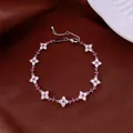 Sparkling flower charm bracelet with pink and white zirconia on brown fabric background - No 41 Fuchsia Petal Splicing Style