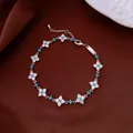 Elegant silver bracelet with turquoise beads and sparkly flower-shaped crystal clusters - No 42 Blue Zirconia Floral Cluster Style