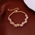 Elegant gold bracelet with sparkling pink and clear crystals on a dark silk background - No 46 Pink White Mixed Gem Style
